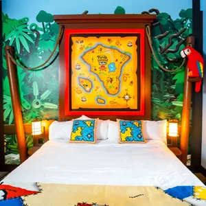 Adult sleeping area in a themed suite at Pirate Island Hotel