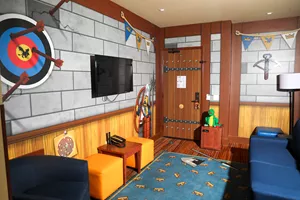 Lounge area in a knights & dragons themed suite