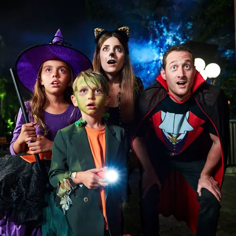 Family in costumes at Brick-or-Treat