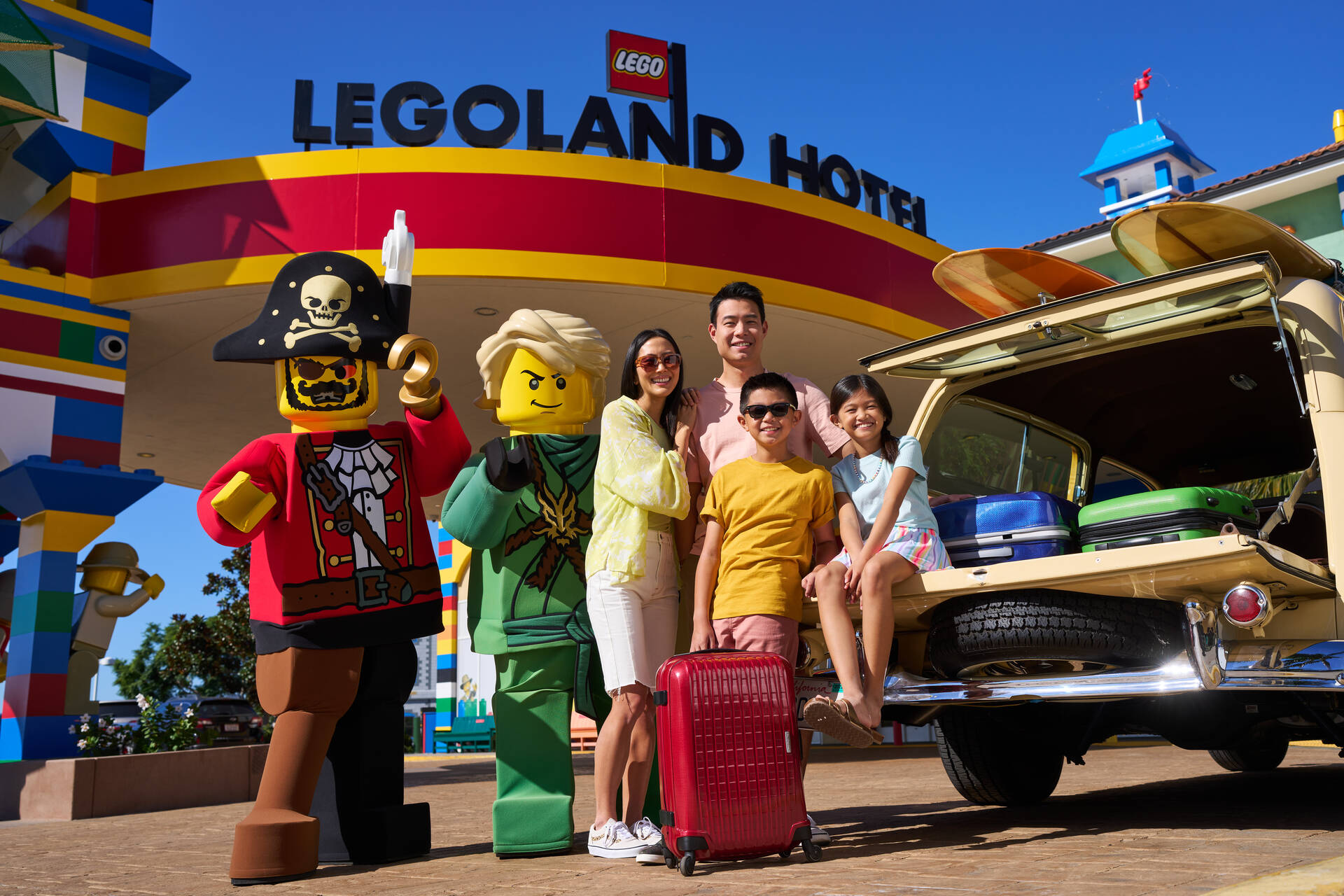 Family Poses with LEGO Characters Outside the LEGOLAND Hotel