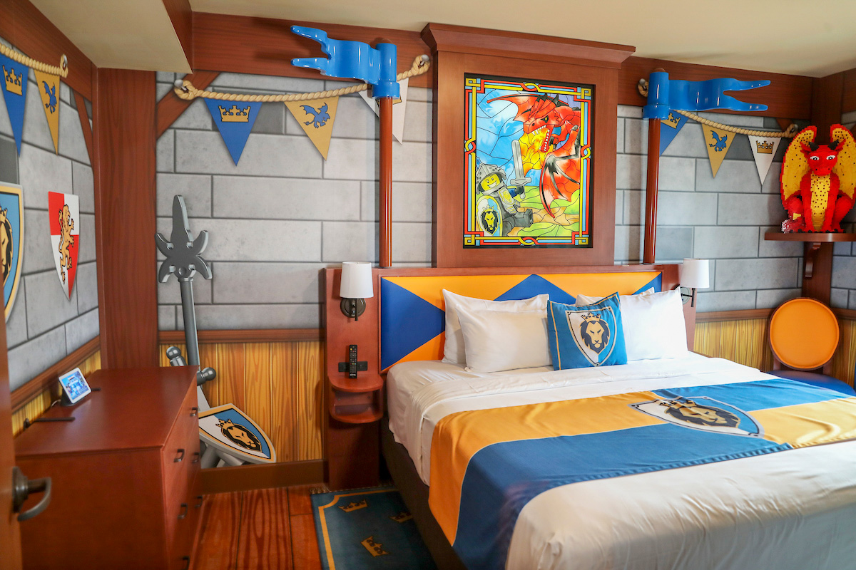 Adult bed in a knights & dragons themed room