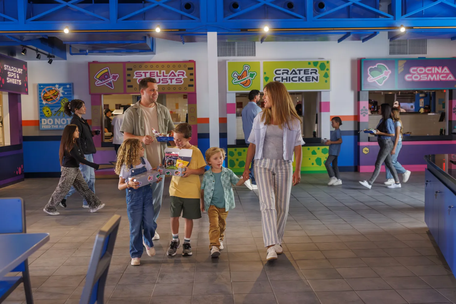 Family walking through U.F.O at LEGO Galaxy