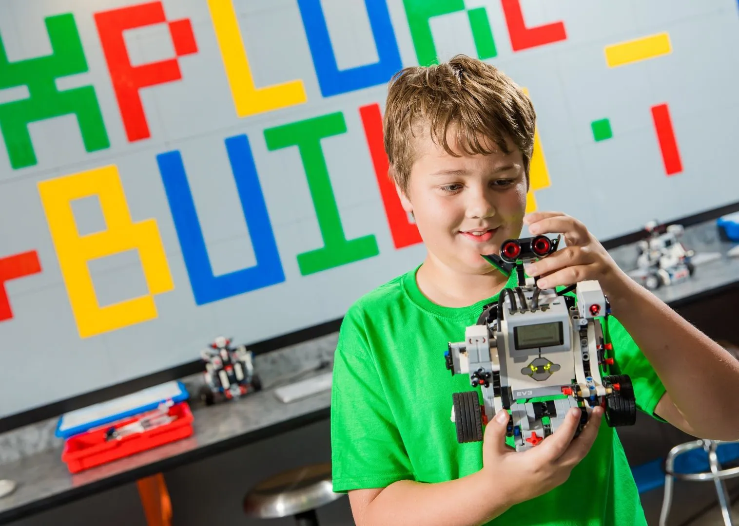 Kid with LEGO model
