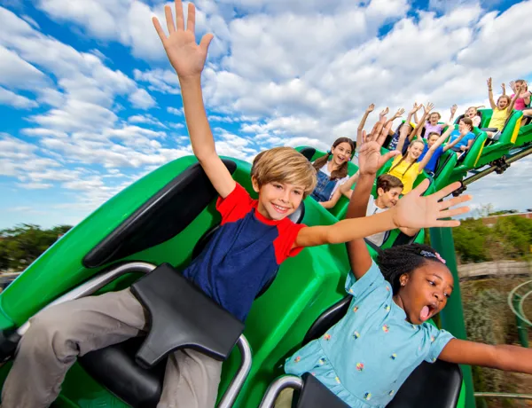 Kids riding the Dragon with their hands up at LEGOLAND California