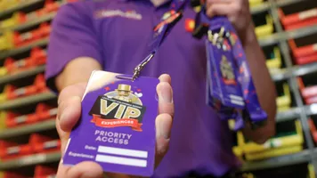 VIP Host holding VIP badge at Legoland California