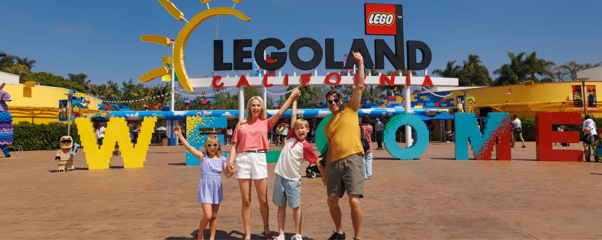 Family in from of LEGOLAND California entrance
