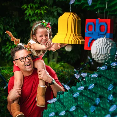 Dad and Daughter with Ornament