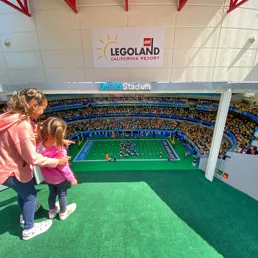 Girls looking at Sofi Stadium in MINILAND