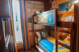 Kids' sleeping area in a knights & dragons themed room