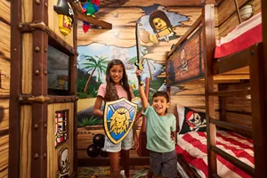 Kids Pose Heroically in a Pirate Room Kids Sleeping Area