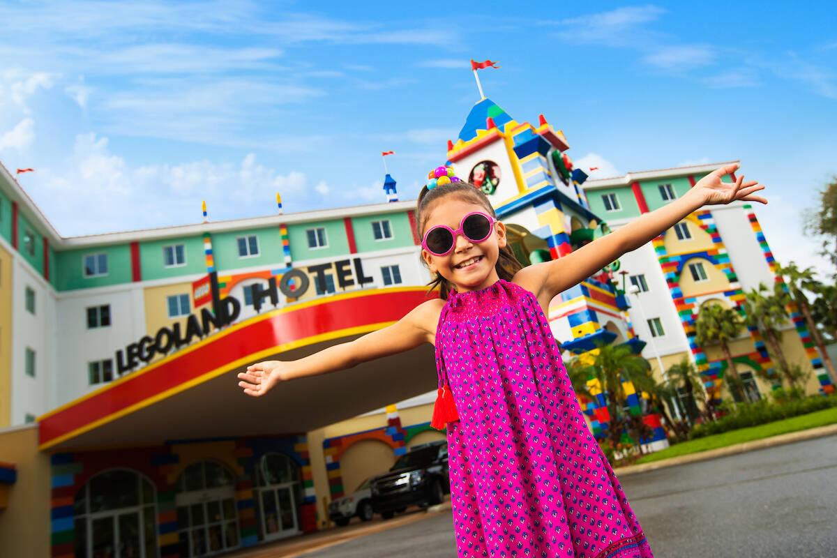 Girl Poses in Front of LEGOLAND Hotel
