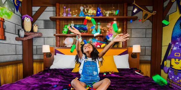 Girl Plays with LEGO in a Wizard Room