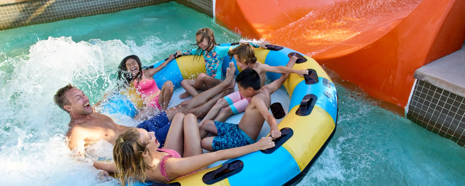 Family riding Orange Rush ride at LEGOLAND California Water Park