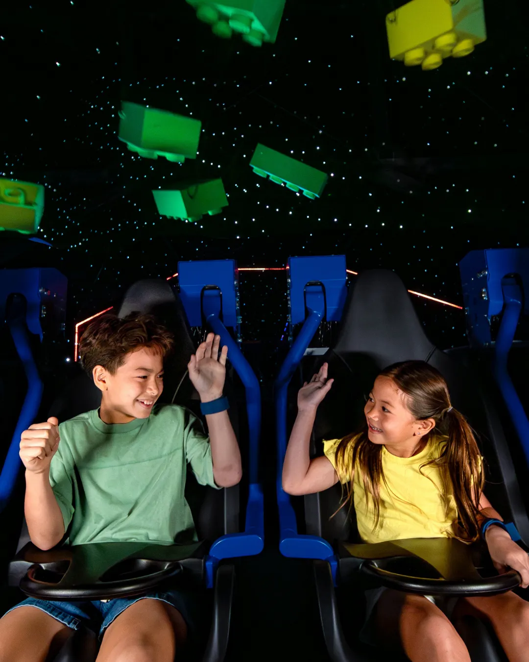 Family enjoying riding the new LEGO Galacticoaster Ride at LEGOLAND Florida Theme Park 