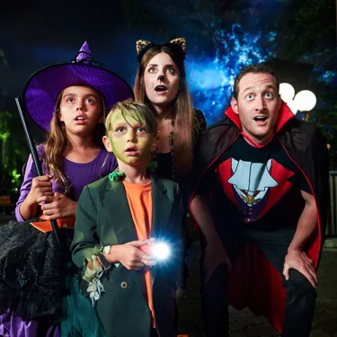 Family in costumes at Brick-or-Treat