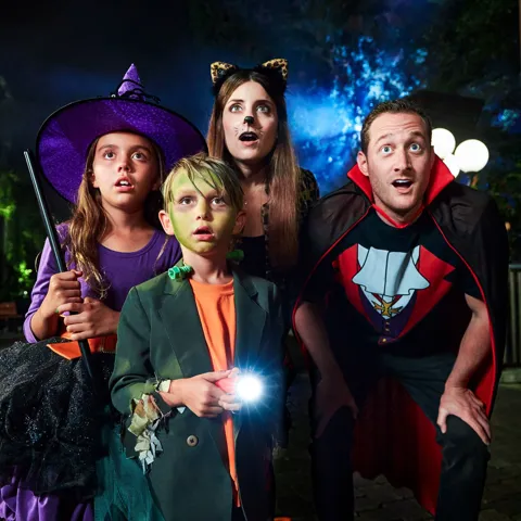 Family in costumes at Brick-or-Treat