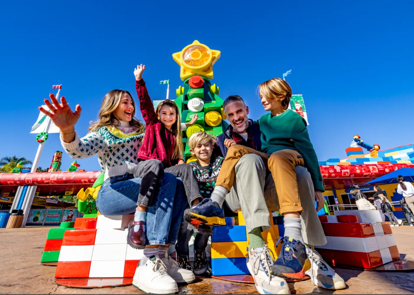 Family in fron to Christmas Tree LEGO Model
