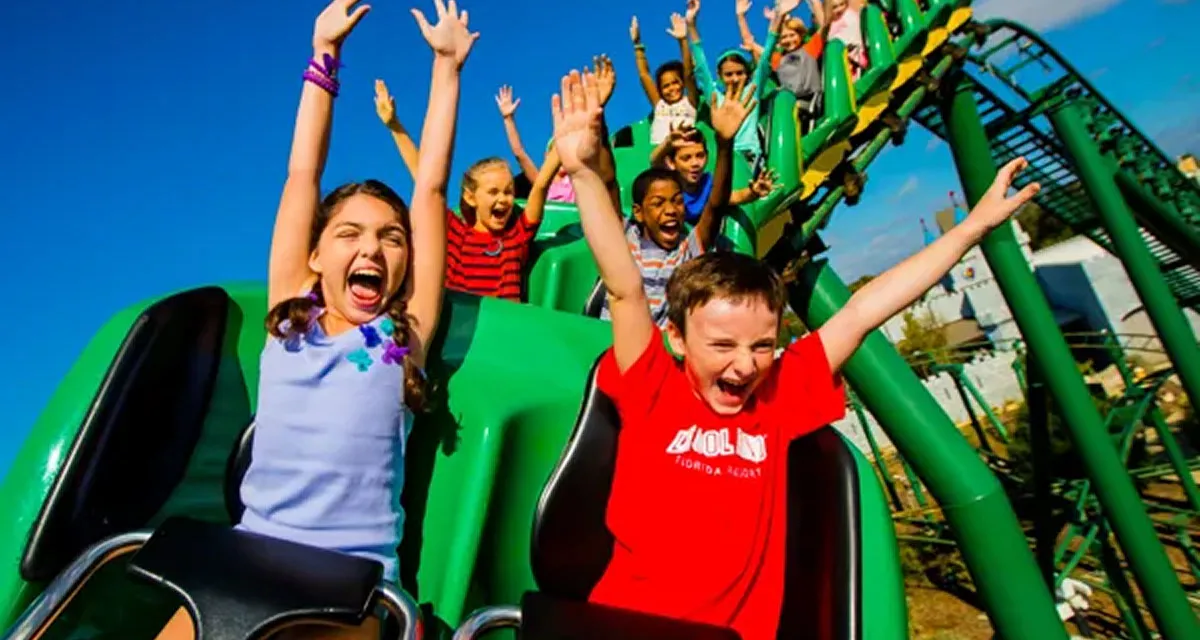 Children cheering on a theme park ride