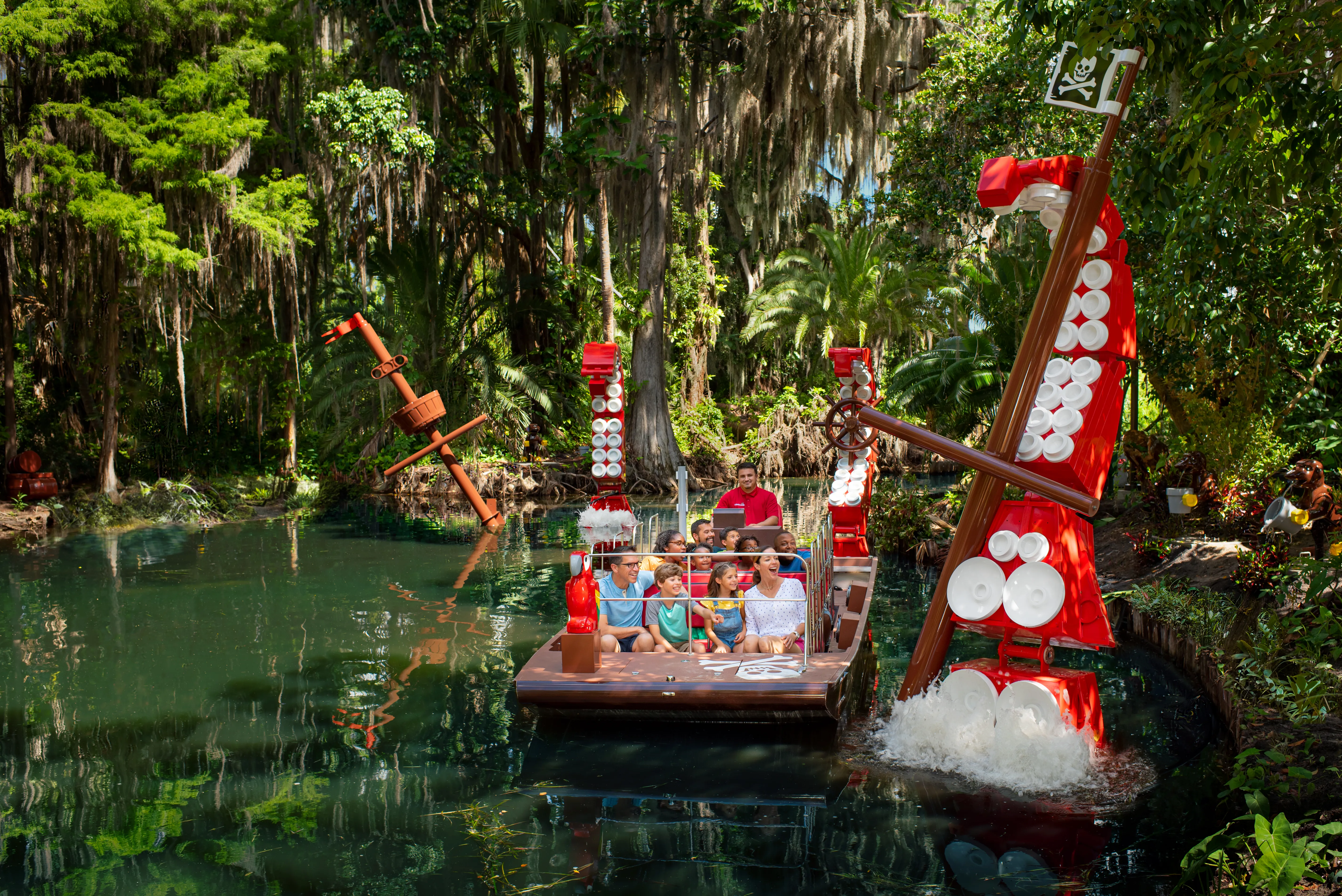 Guests on boat riding Pirate River Quest