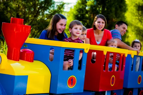 A family enjoying a ride on the DUPLO Train