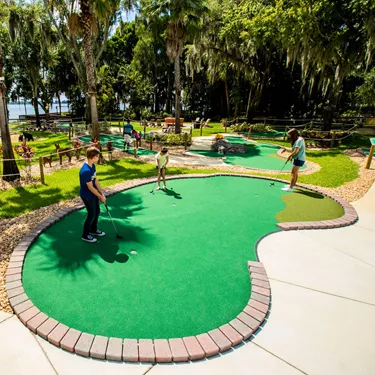 Kids Play the Practice Hole at Wild Side Mini Golf