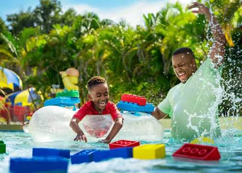 Two Kids playing in the Build-a-Raft Lazy River