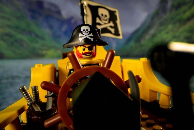 LEGO Redbeard sails in an animated Pirate River Quest vessel