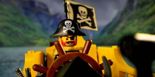 LEGO Redbeard sails in an animated Pirate River Quest vessel
