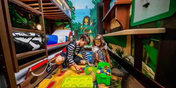 Kids Play with LEGO in a Pirate Island Hotel Room