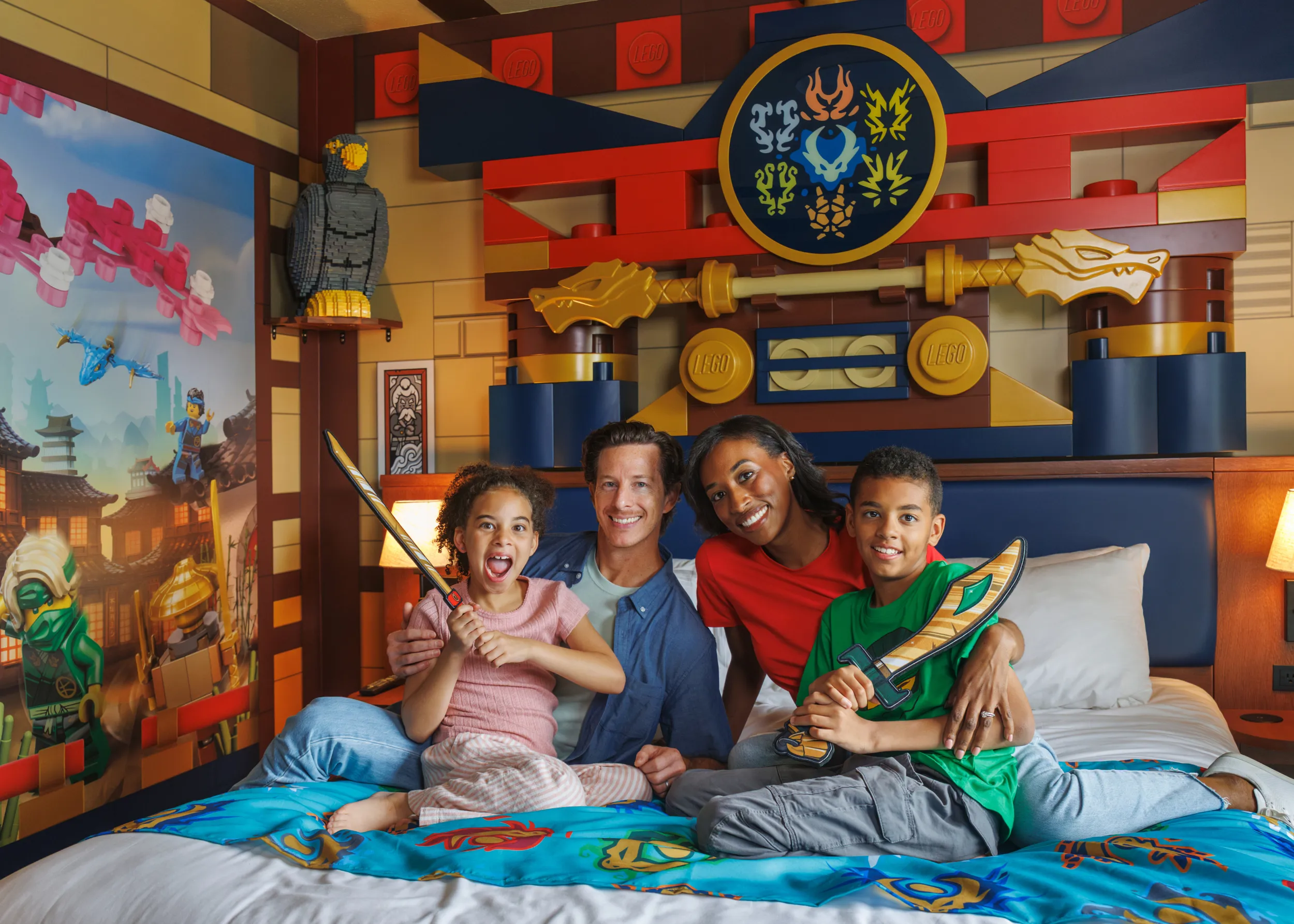 A family of four in their LEGO NINJAGO themed room at LEGOLAND Florida Resort