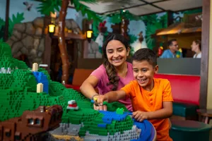 Mom and Son Play in the Pirate Island Hotel Building Area