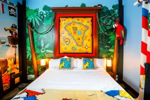 Adult sleeping area in a themed suite at Pirate Island Hotel