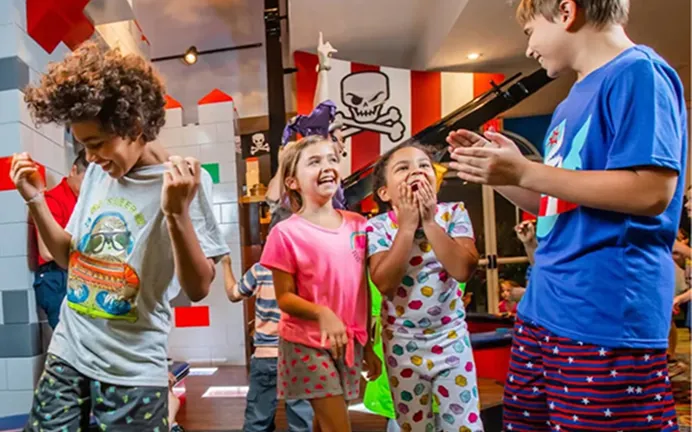 Children in pyjamas enjoying an evening event