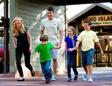 Family laughing while walking around LEGOLAND Florida