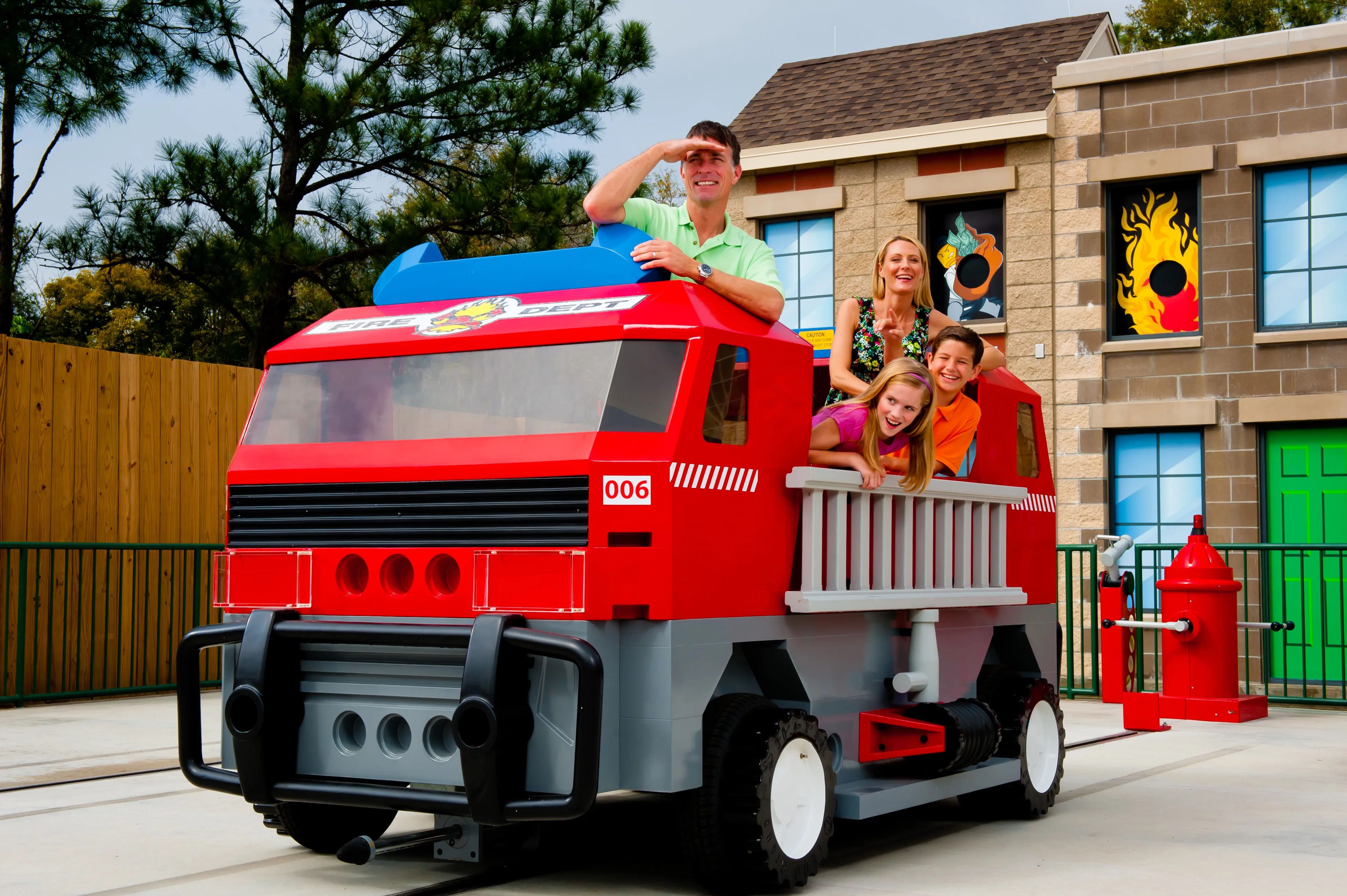 Family posing in the Firetruck attraction