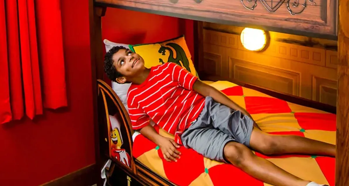 A themed kids' bunk sleeping area within a hotel room