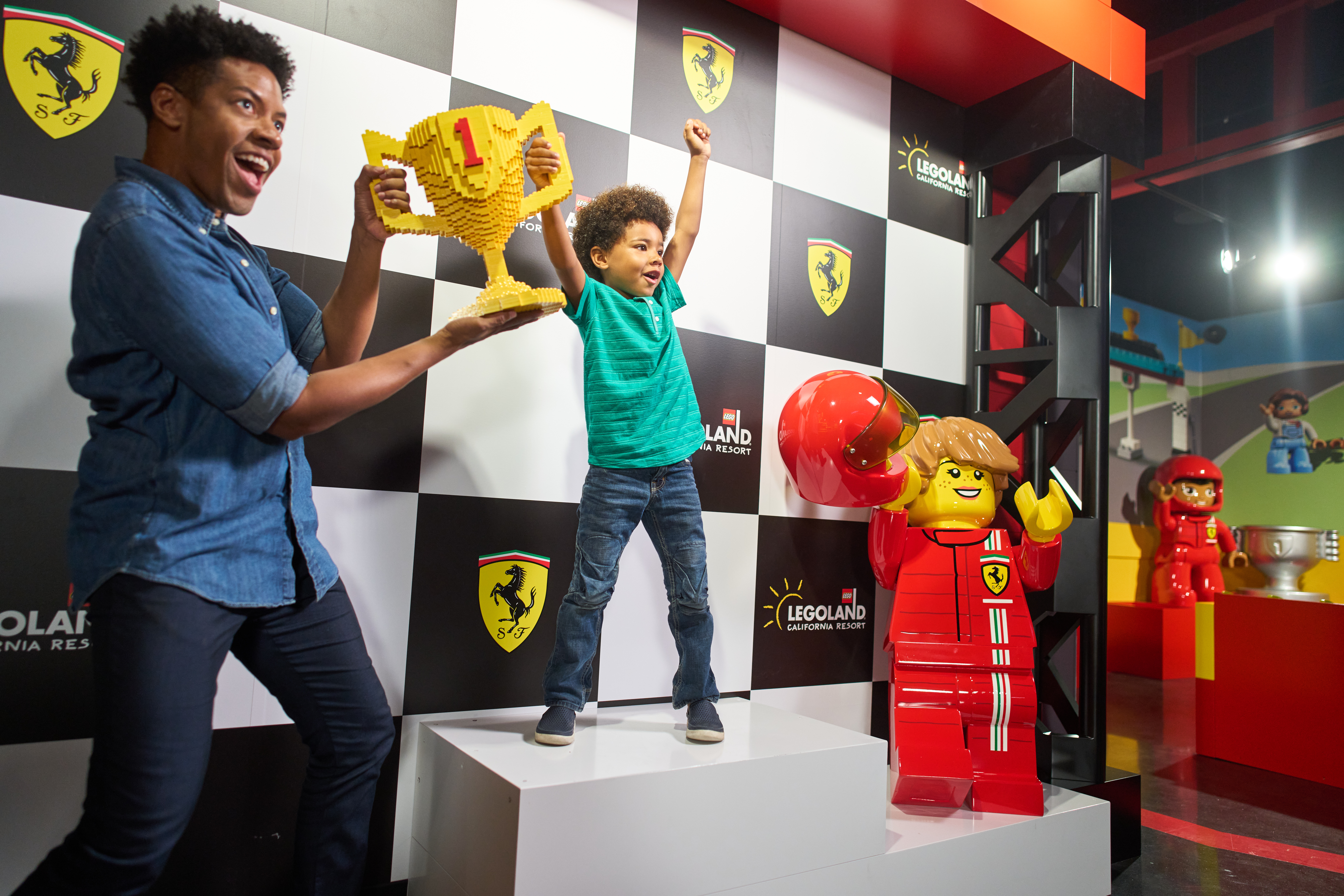 Father & Son holding LEGO Trophy at Ferrari Build and Race
