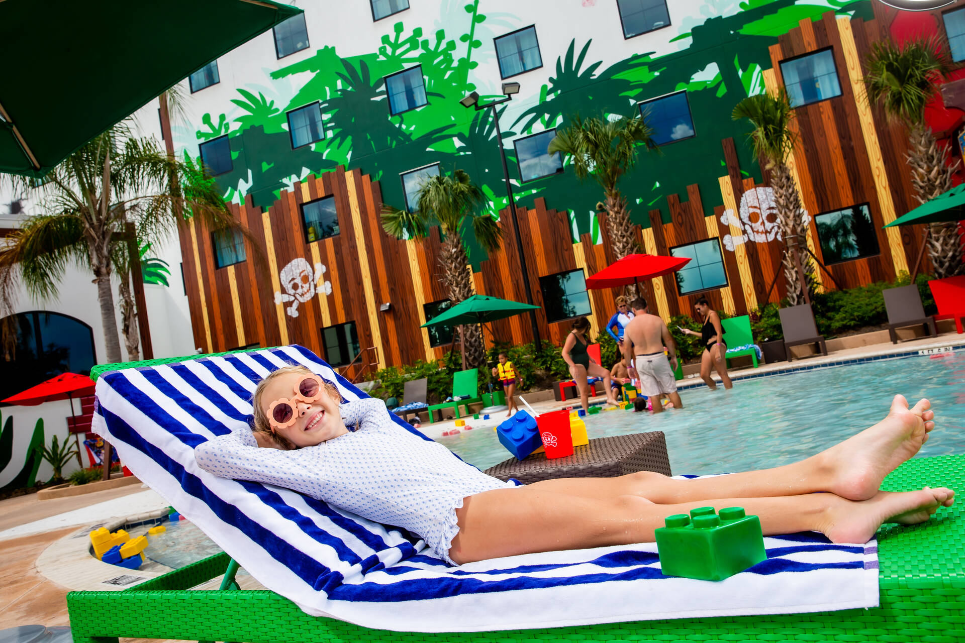 Girl Lounges at the Pirate Island Hotel Pool