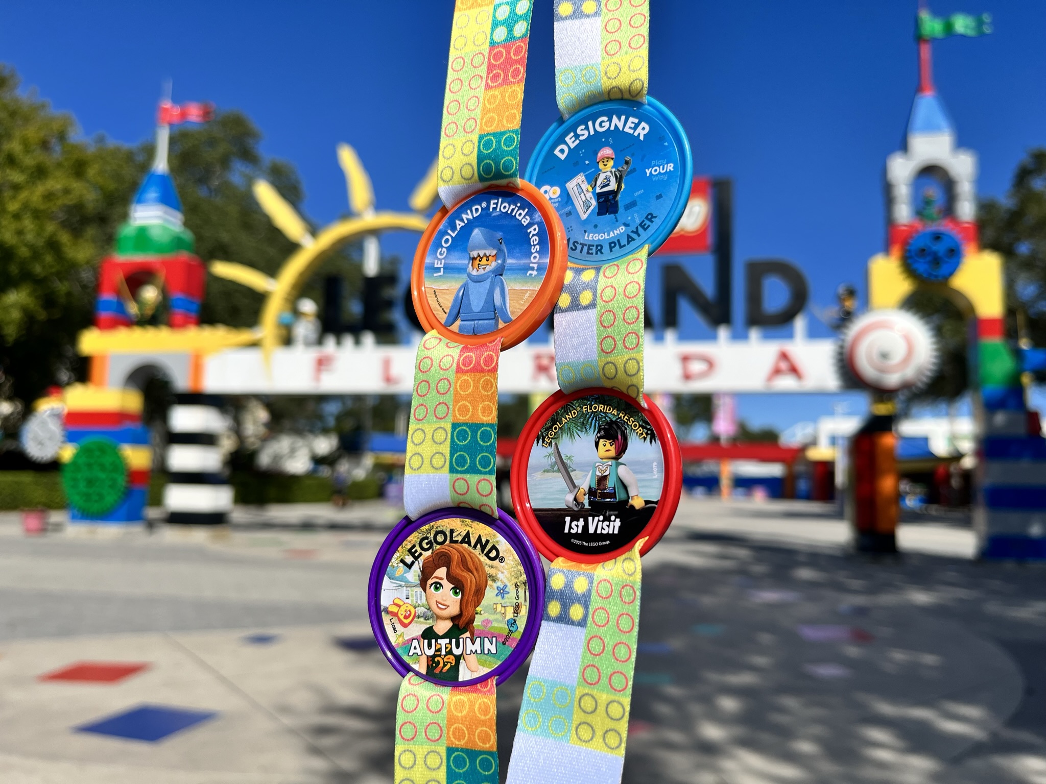 Pop Badges on Lanyard in front of LEGOLAND Florida