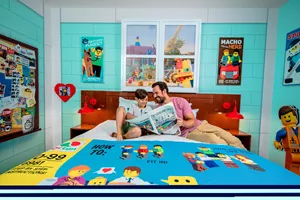 Family relaxing in a LEGO MOVIE WORLD themed hotel room