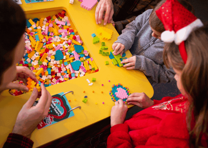 Children building LEGO Hearts for Build to Give