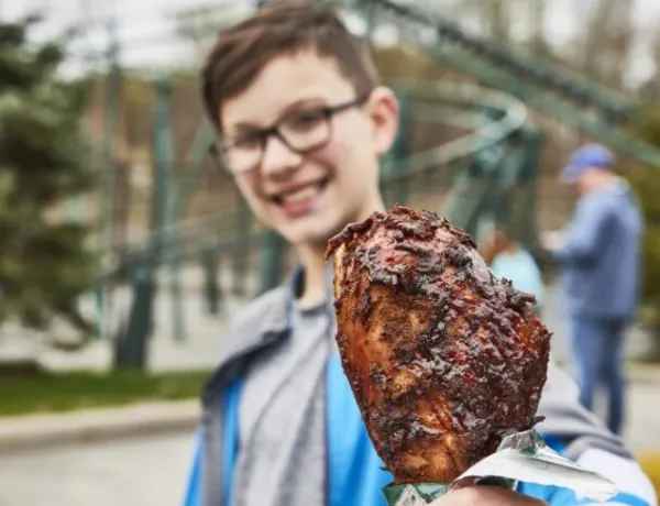 Boy holding turkey leg