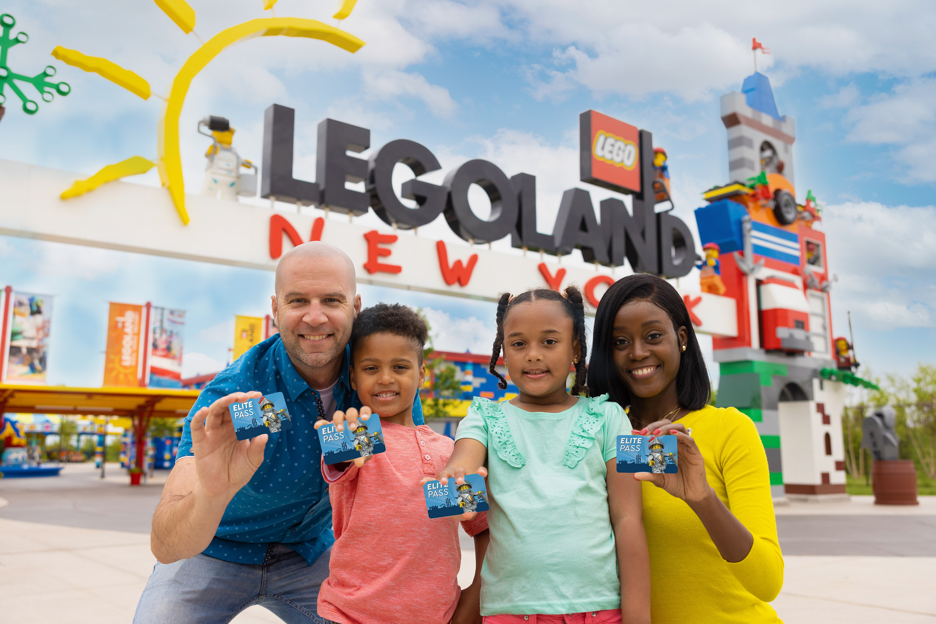 Family showing annual passes at the entrance of LEGOLAND New York
