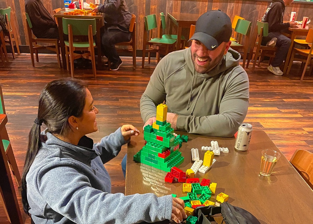 Adults Building With LEGO During Adult Night 7X5