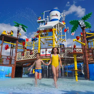 Cool down with splashes, sprays & slides at our Water Playground.
