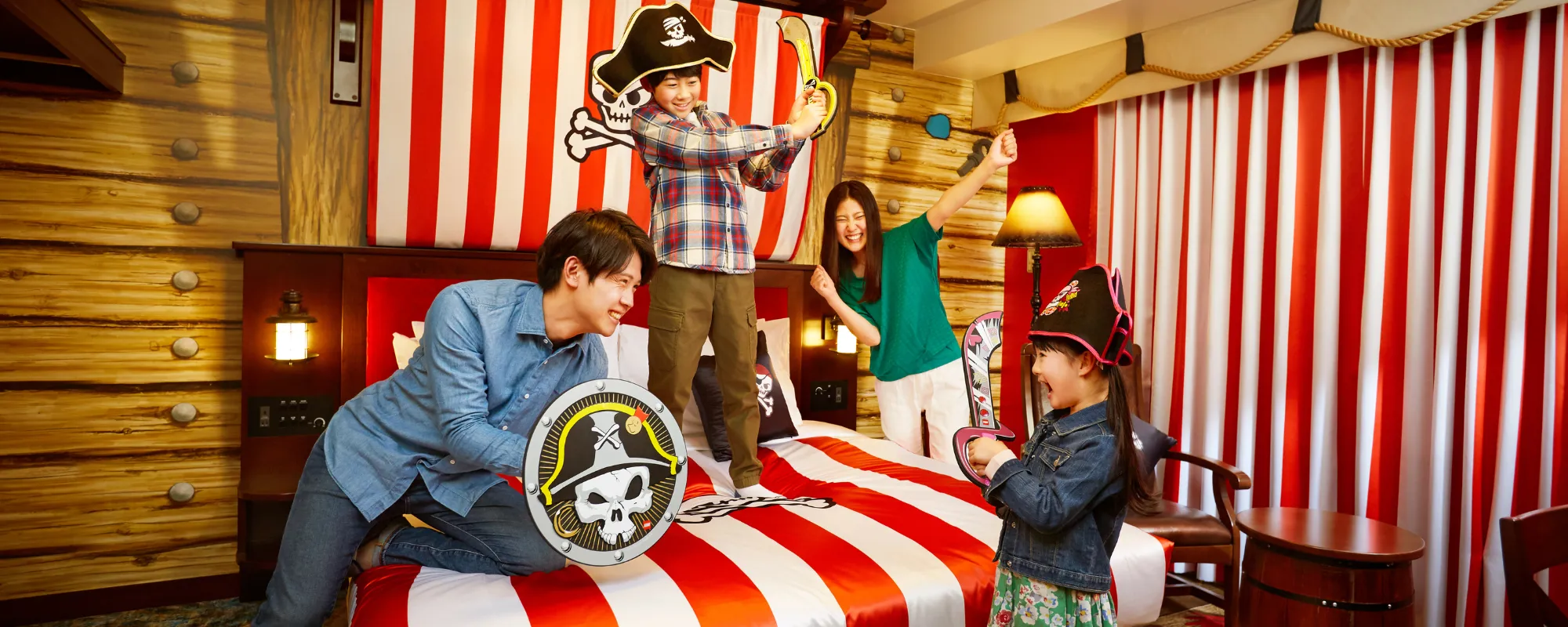 Family Plays like Pirates in their Themed Hotel Room