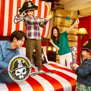 Family Plays like Pirates in their Themed Hotel Room