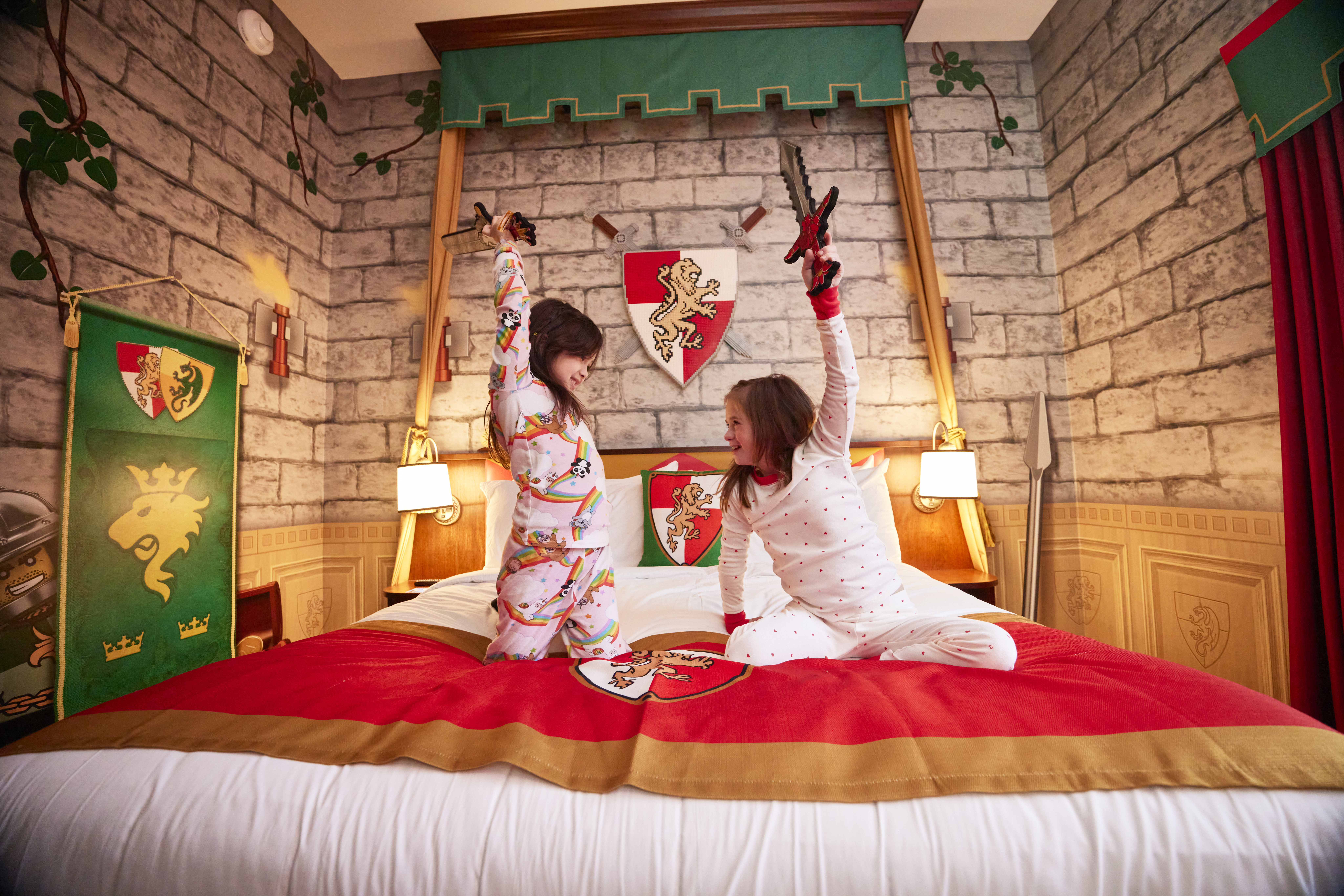 Kids playing on a Kingdom room bed