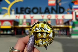 Mr. Gold Pop Badge in front of LEGOLAND New York