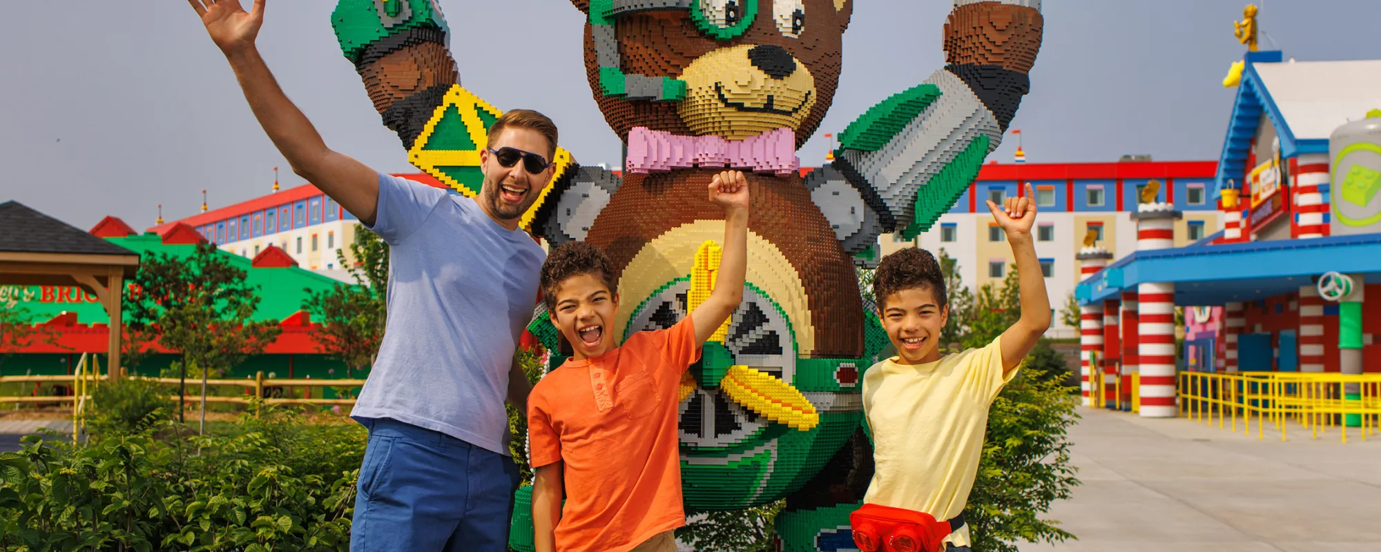 Family in front of BRICKTOPIA sign